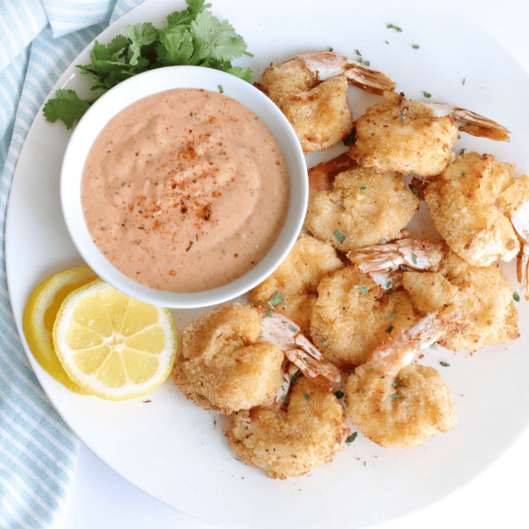 “crispy Long John Silver’s battered shrimp on plate with lemon wedge”