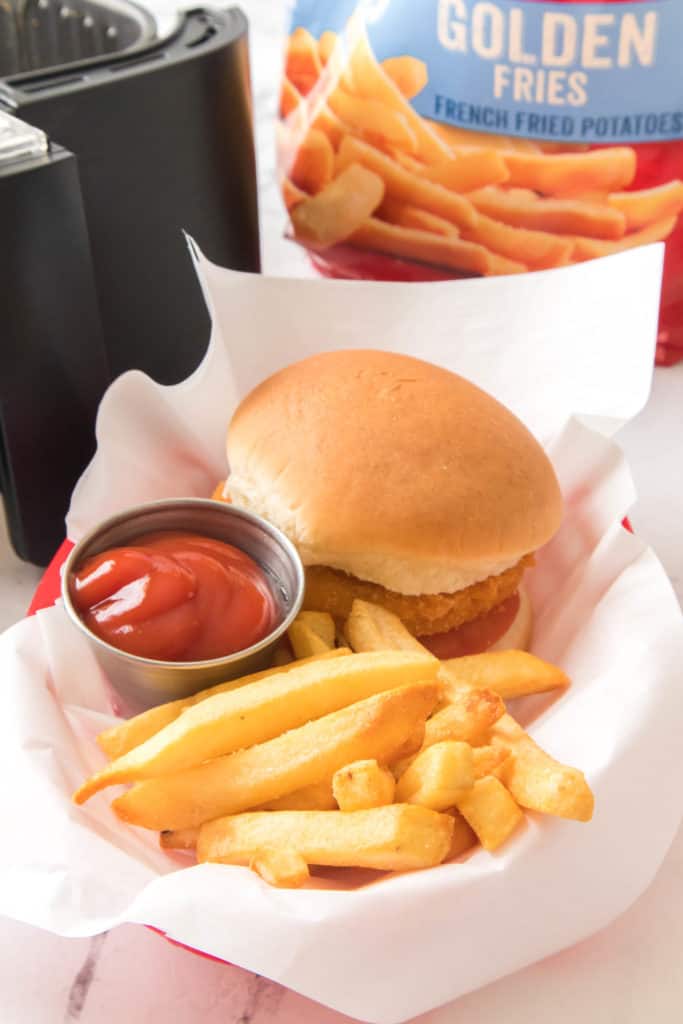 steak fries with a sandwich and dipping sauce