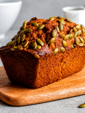 Sliced air fryer copycat Starbucks pumpkin bread stacked on a wooden cutting board