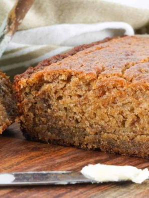 Sliced air fryer gluten-free banana bread on a wooden cutting board