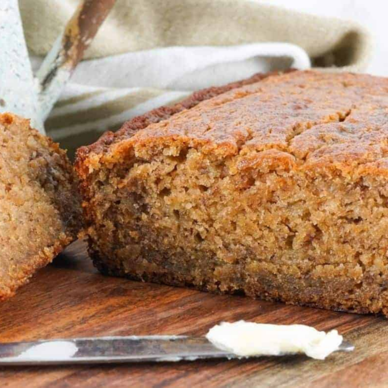 Air fryer gluten-free banana bread sliced to show its moist crumb