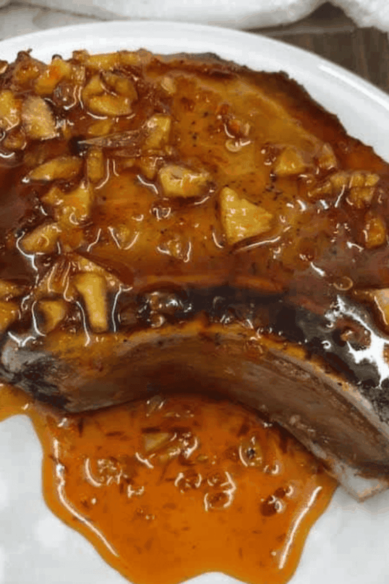 Air Fryer Honey Garlic Pork Chops cooked golden brown and garnished with parsley, ready to serve.