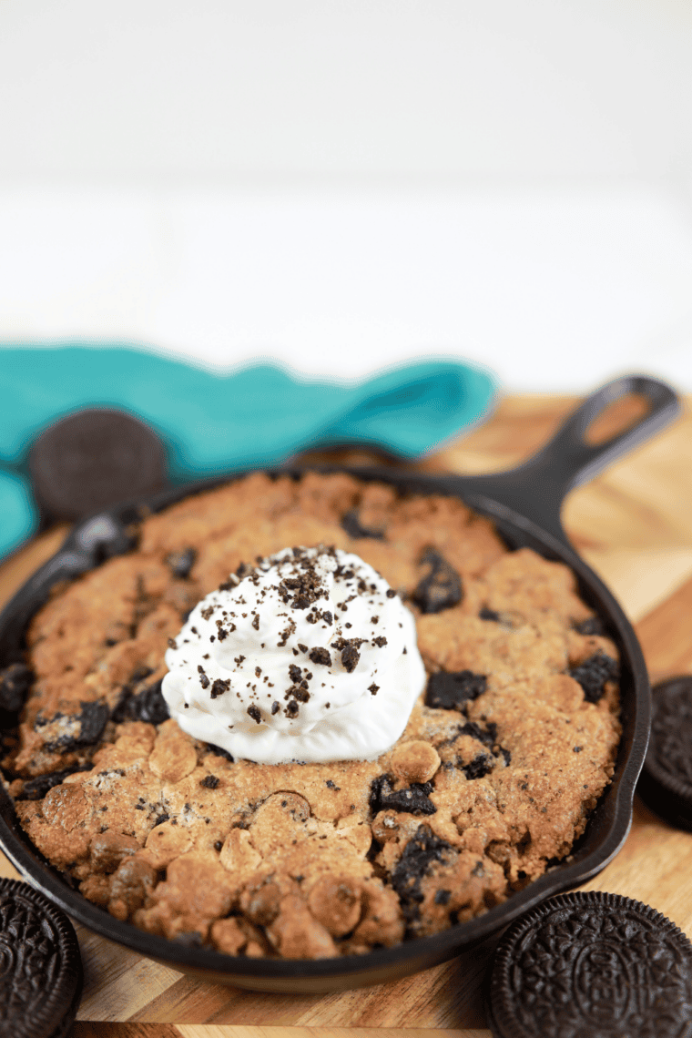 Oatmeal chocolate chip cookie pizza fresh from the air fryer, golden brown and studded with melty chocolate chips.