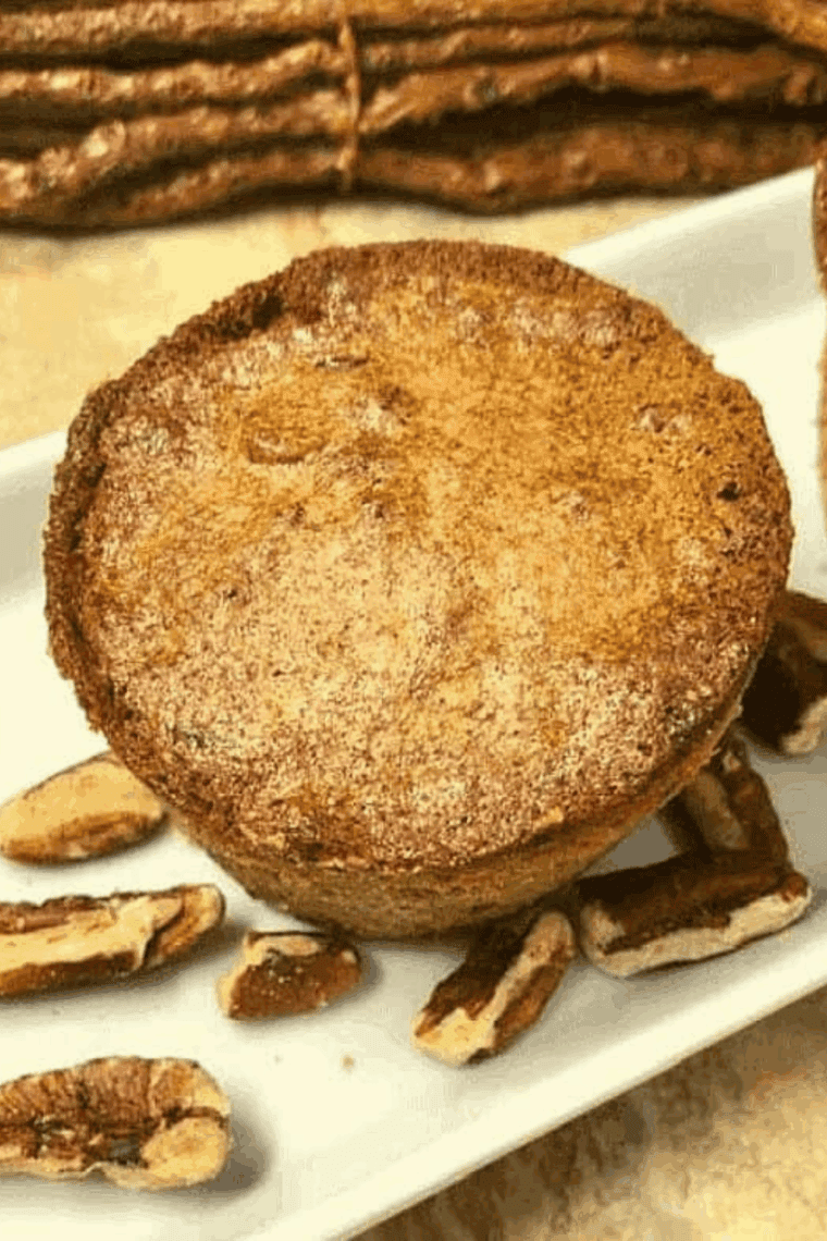 Golden, soft air fryer pecan pie muffins topped with chopped pecans