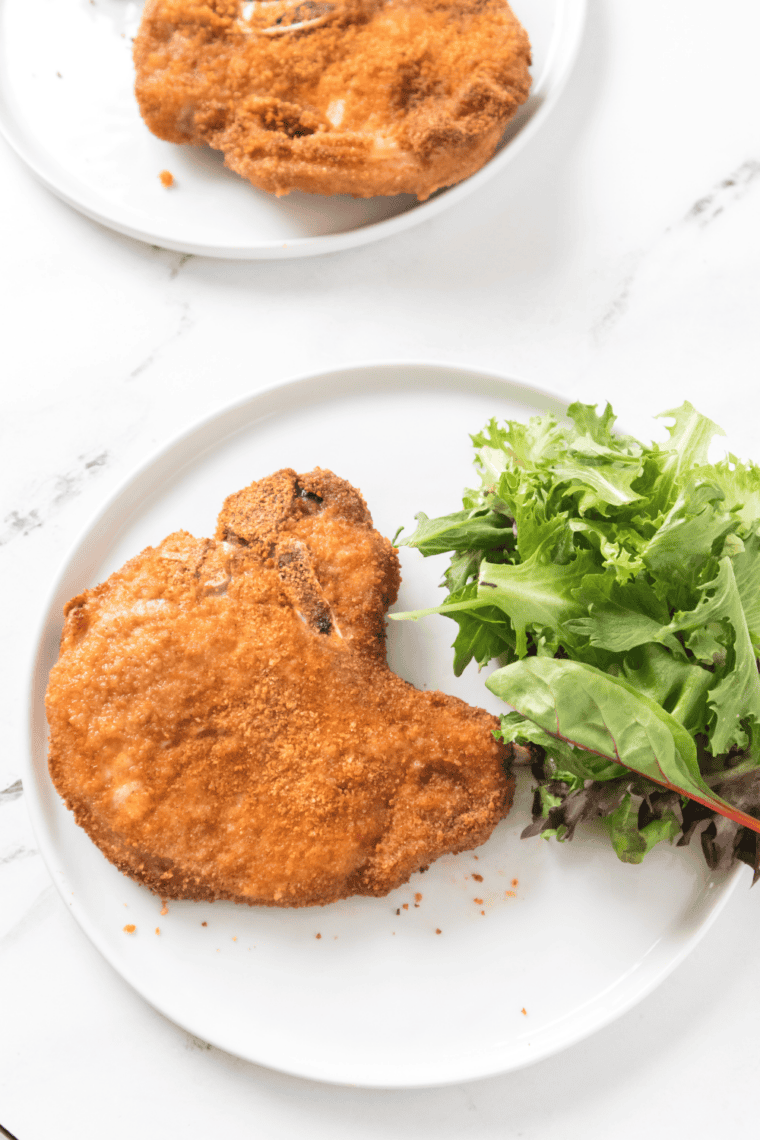 Close-up of juicy Air Fryer Shake and Bake Pork Chops with crispy breading