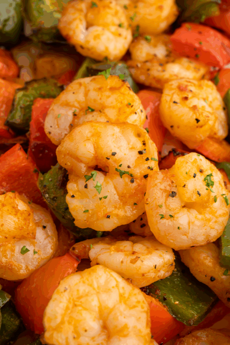 Crispy sweet and sour shrimp cooked in the air fryer, served over rice with tangy sauce