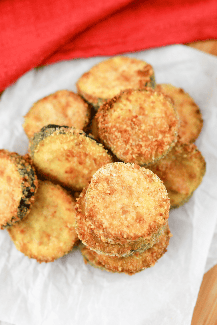 Plate of crispy golden fried zucchini sticks, copycat Carl’s Jr. style, ready to serve.