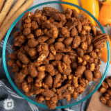Bowl of air fryer roasted mixed nuts with almonds, pecans, cashews, and walnuts tossed in herbs