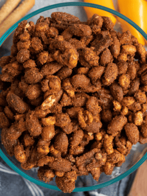 Bowl of air fryer roasted mixed nuts with almonds, pecans, cashews, and walnuts tossed in herbs