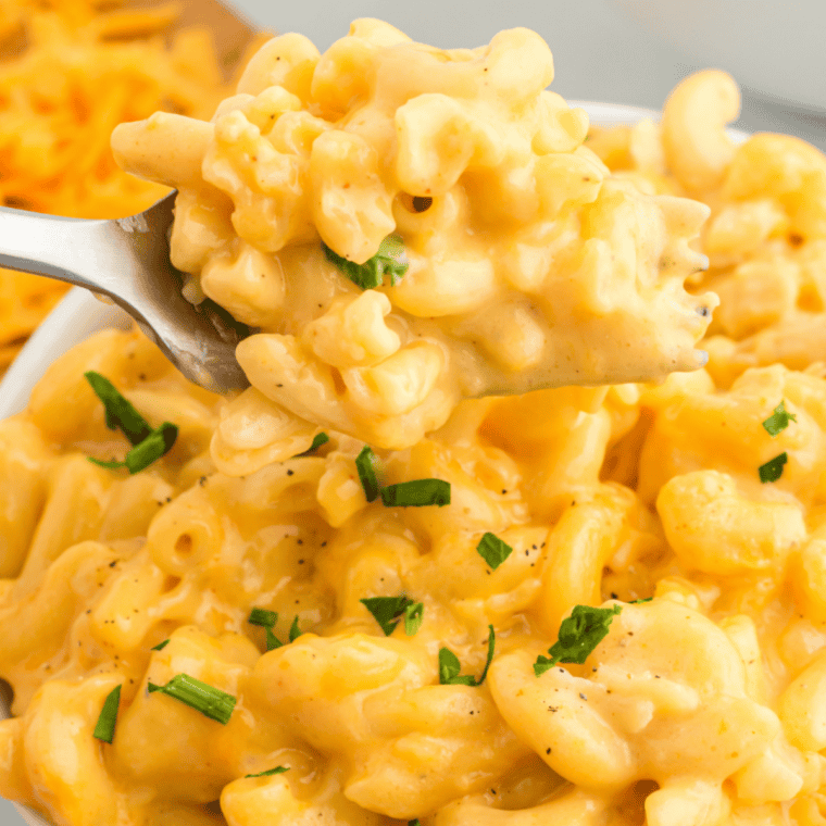 Bowl of Instant Pot boxed mac and cheese with cheesy sauce coating elbow noodles.