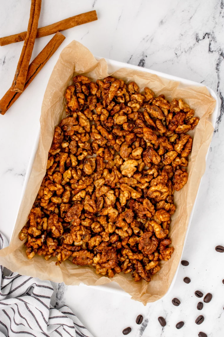 overhead: roasted air fryer walnuts on a baking sheet with parchment
