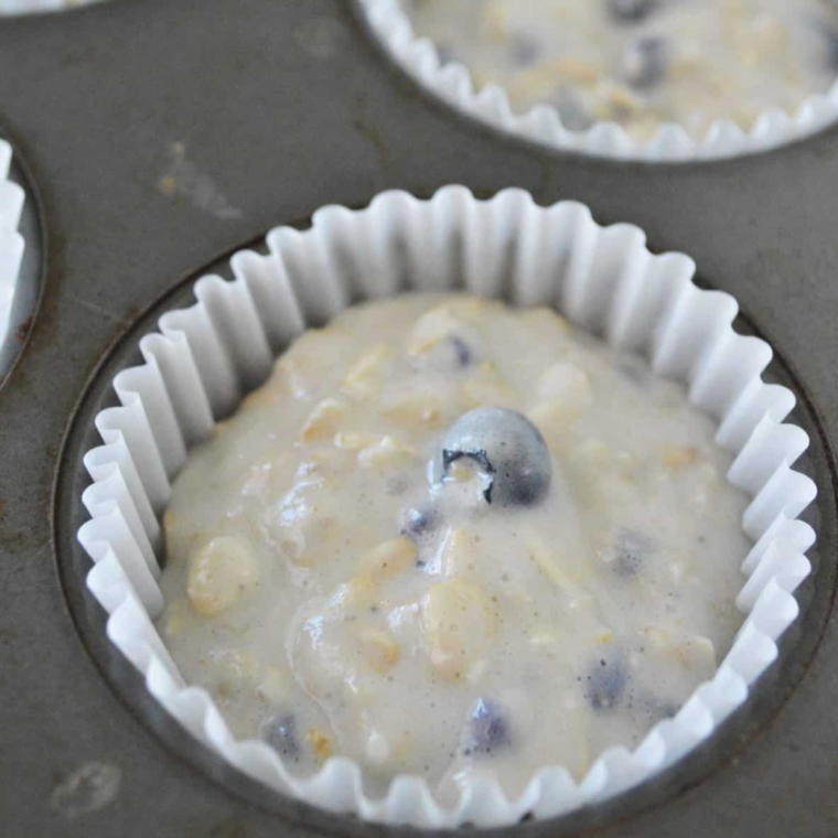 Blueberry banana oatmeal muffins baking in air fryer until golden brown