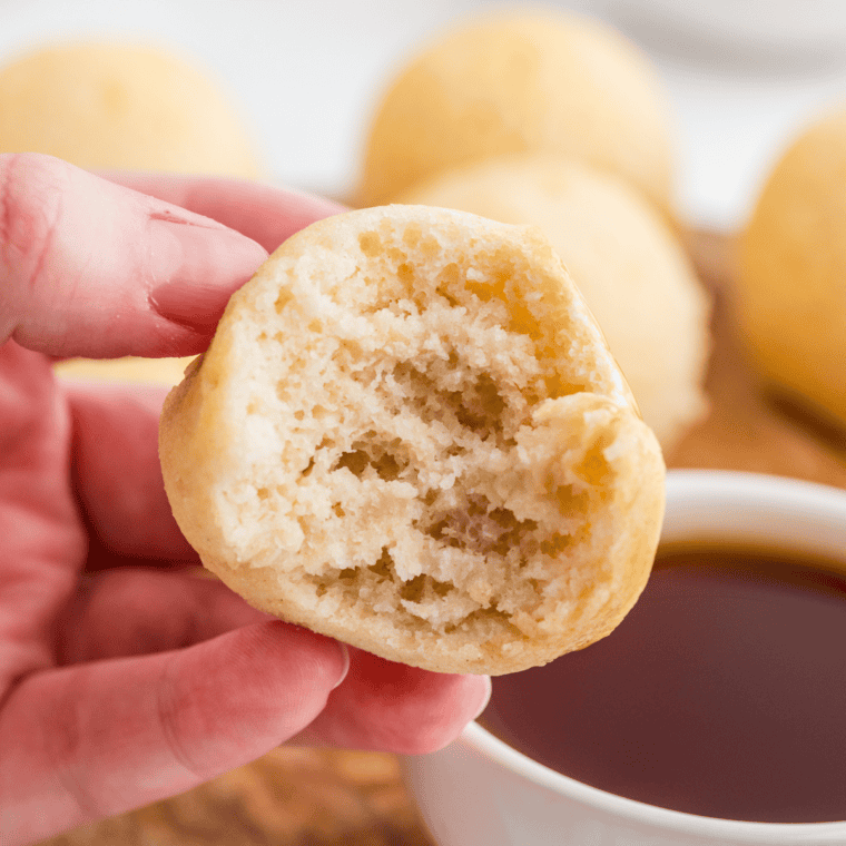 Golden, fluffy Air Fryer Pancake Bites served on a plate with syrup and berries for a quick breakfast.