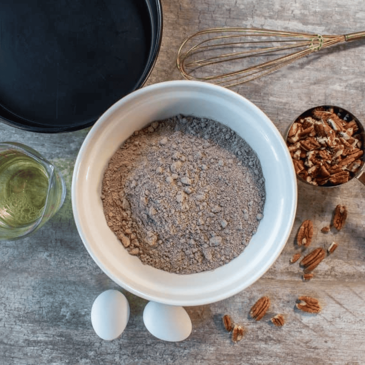 Ingredients laid out for Air Fryer Skillet Brownies, including flour, sugar, and cocoa powder