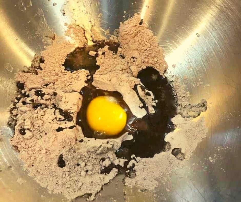 Mixing brownie batter in a bowl for Air Fryer Skillet Brownies