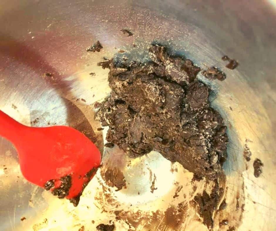 Pouring brownie batter into a skillet ready for the air fryer