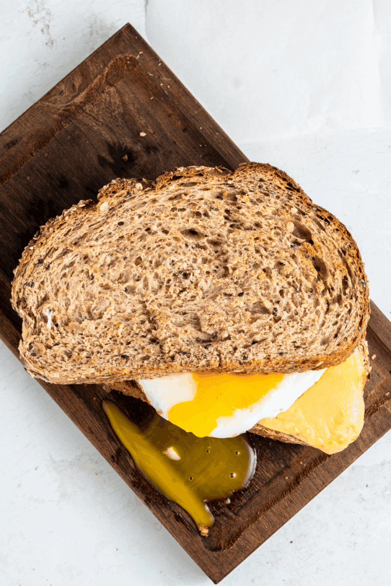 Easy air fryer breakfast grilled cheese with melted cheese on toasted bread