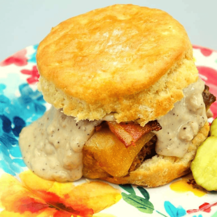 Freshly baked golden Bisquick biscuits in an air fryer basket, ready to enjoy.