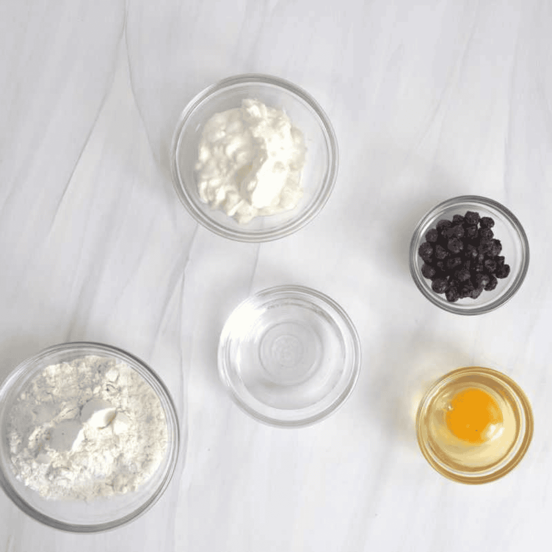 Ingredients for blueberry bagels: self rising flour, Greek  yogurt, egg wash ingredients, fresh, dried, or frozen blueberries