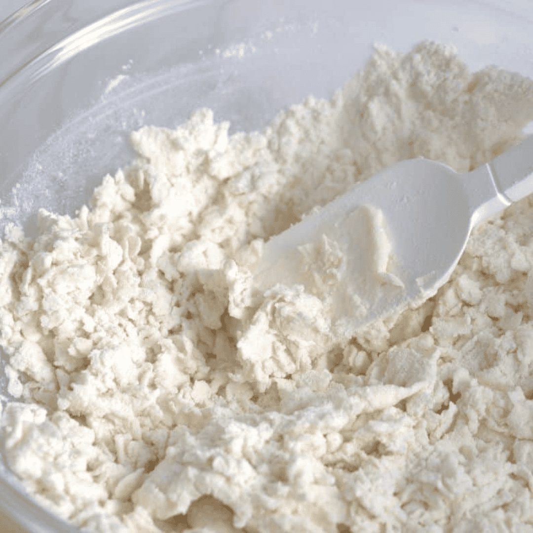 Mixing Greek yogurt and self-raising flour to make bagel dough