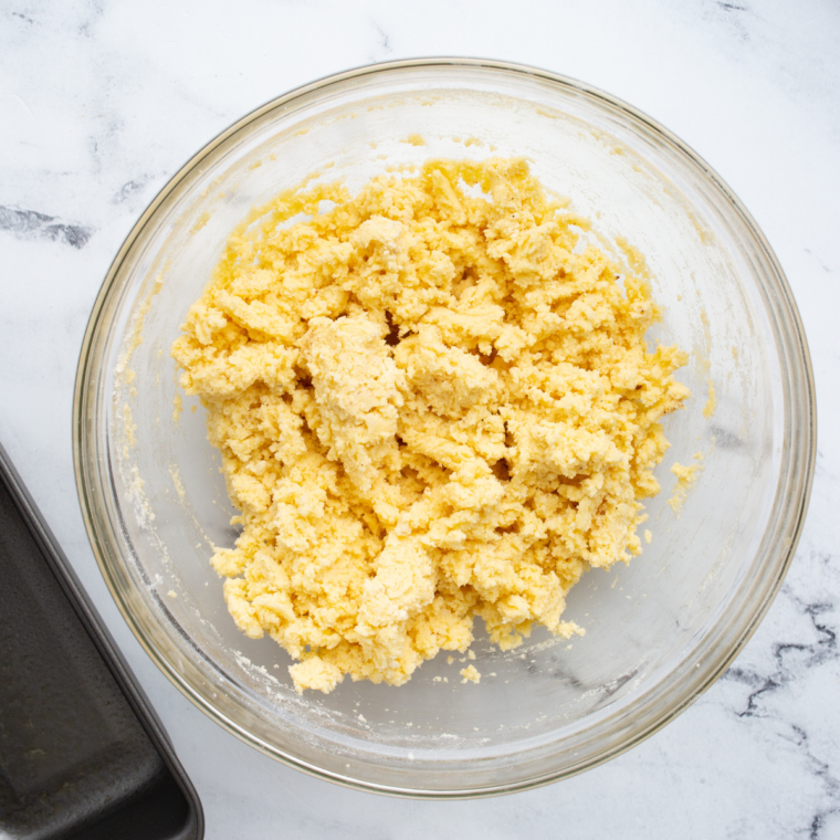 Folding all-purpose flour into pound cake batter on low speed