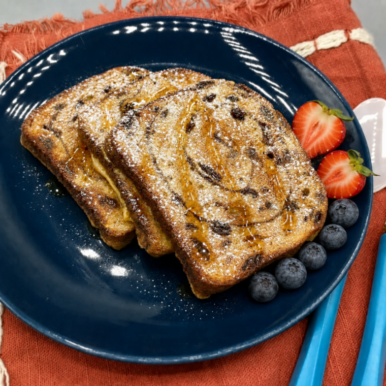 Crisp golden slices of air fryer cinnamon raisin french toast fresh from the basket