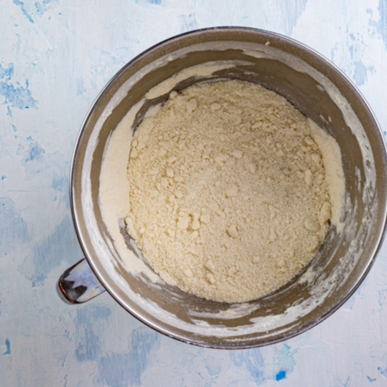 Whisking flour, baking powder, baking soda, and salt in a glass bowl