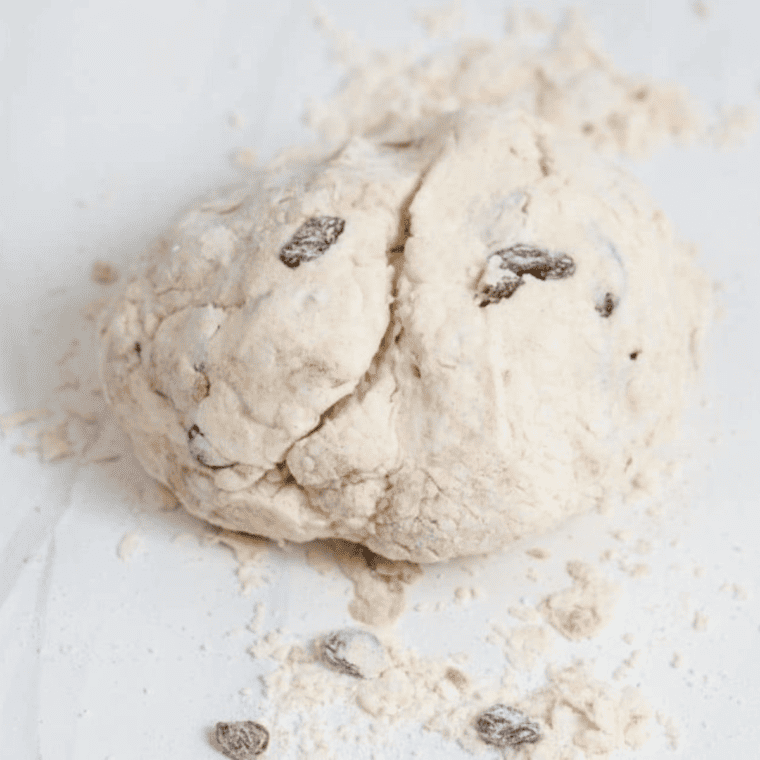 Mixing dough for Air Fryer Cinnamon Raisin Bagels in a bowl"