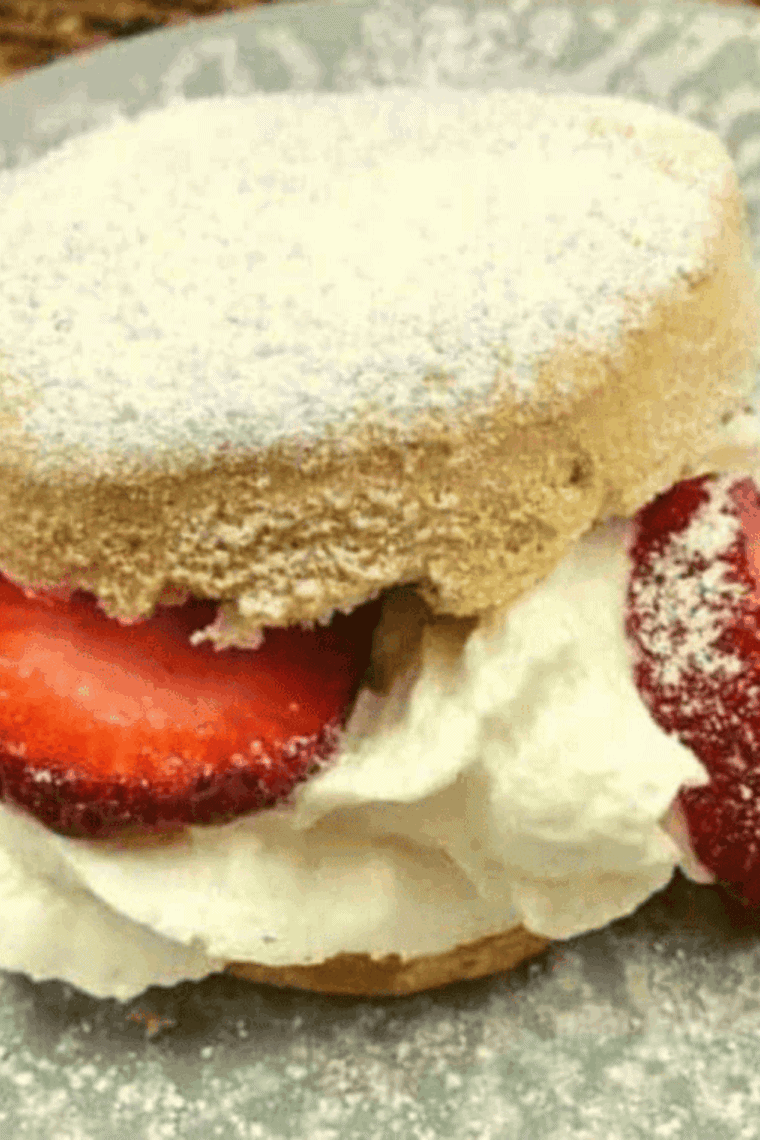 Air fryer biscuit strawberry shortcake with fresh strawberries and whipped cream.