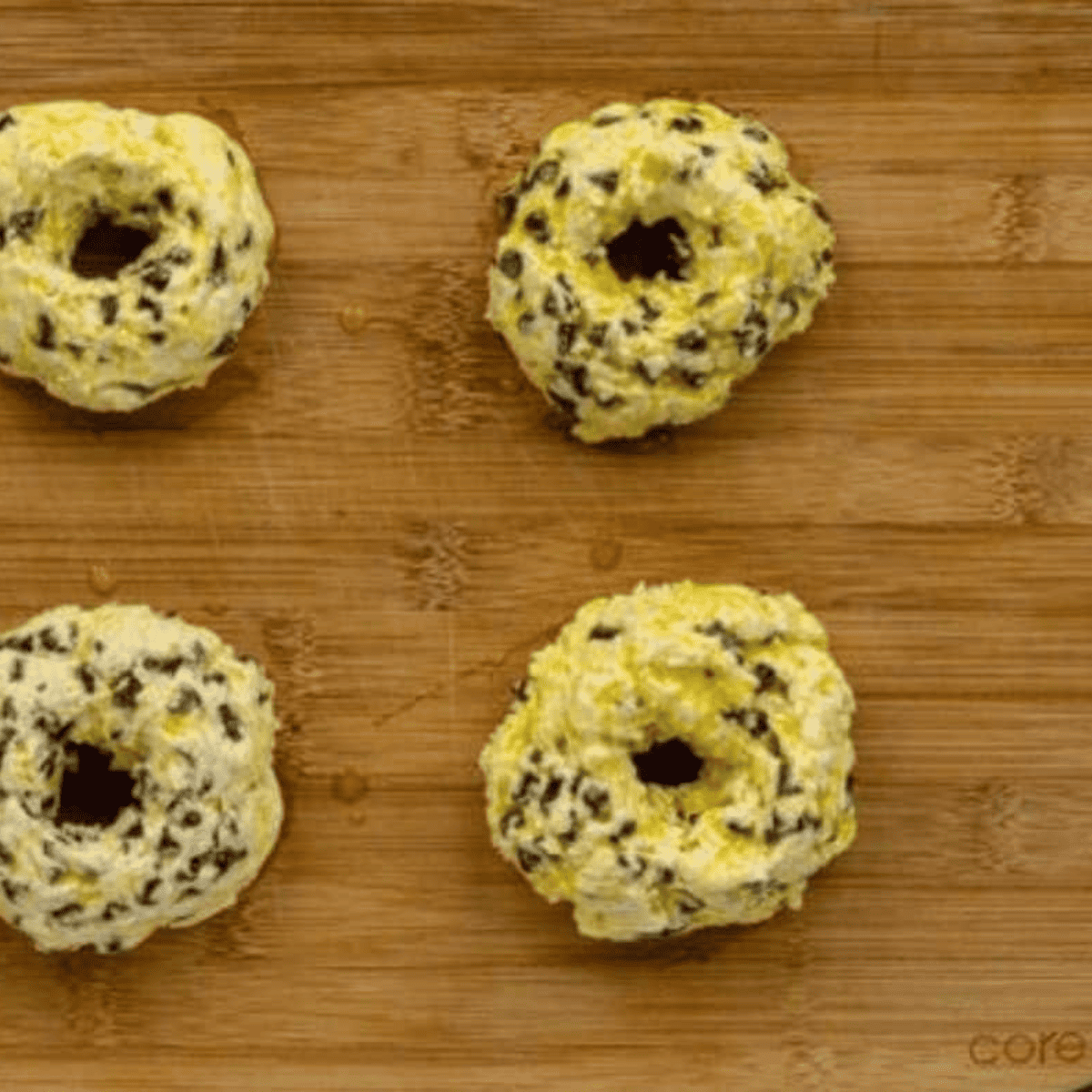 Apply an egg wash over the chocolate chip bagels.