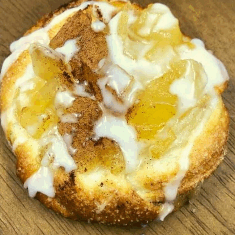 Flaky Air Fryer Crescent Roll Apple Danish with sweet apple filling, dusted with powdered sugar.