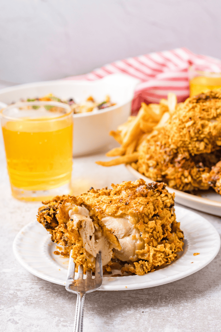 Sliced air fryer crunchy onion chicken showing juicy interior and crisp crust