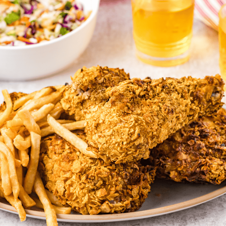 Forkful of juicy chicken with crunchy onion coating, steam rising