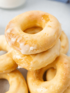 glazed yeast donuts on a blue plate