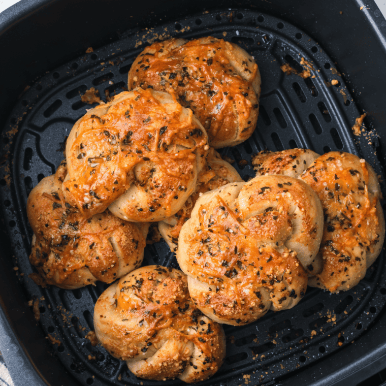 Golden-brown Trader Joe's Air Fryer Garlic Cheddar Knots, crispy, cheesy, and topped with garlic butter.