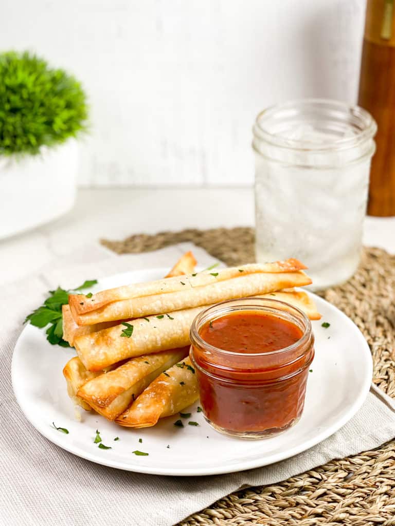 ere are some pro tips for cooking wonton mozzarella sticks in an air fryer: Freeze the Mozzarella Sticks: Freezing the mozzarella sticks before air frying will help them hold their shape and prevent them from melting too quickly. Coat the Sticks Thoroughly: Make sure to coat the mozzarella sticks thoroughly with the egg wash and breadcrumbs to ensure a crispy and golden brown exterior. Don't Overcrowd the Air Fryer: Cook the mozzarella sticks in batches and avoid overcrowding the air fryer basket. This will help ensure even cooking and prevent them from sticking together. Spray with Oil: Lightly spray the mozzarella sticks with cooking spray or oil to help them crisp up and prevent them from sticking to the air fryer basket. Check the Sticks Frequently: Check the mozzarella sticks frequently while they are cooking to prevent them from overcooking and becoming too gooey. Let Them Cool: Allow the mozzarella sticks to cool for a few minutes before serving to avoid burning your mouth on the melted cheese. By following these pro tips, you can make perfectly crispy and delicious wonton mozzarella sticks in your air fryer every time.