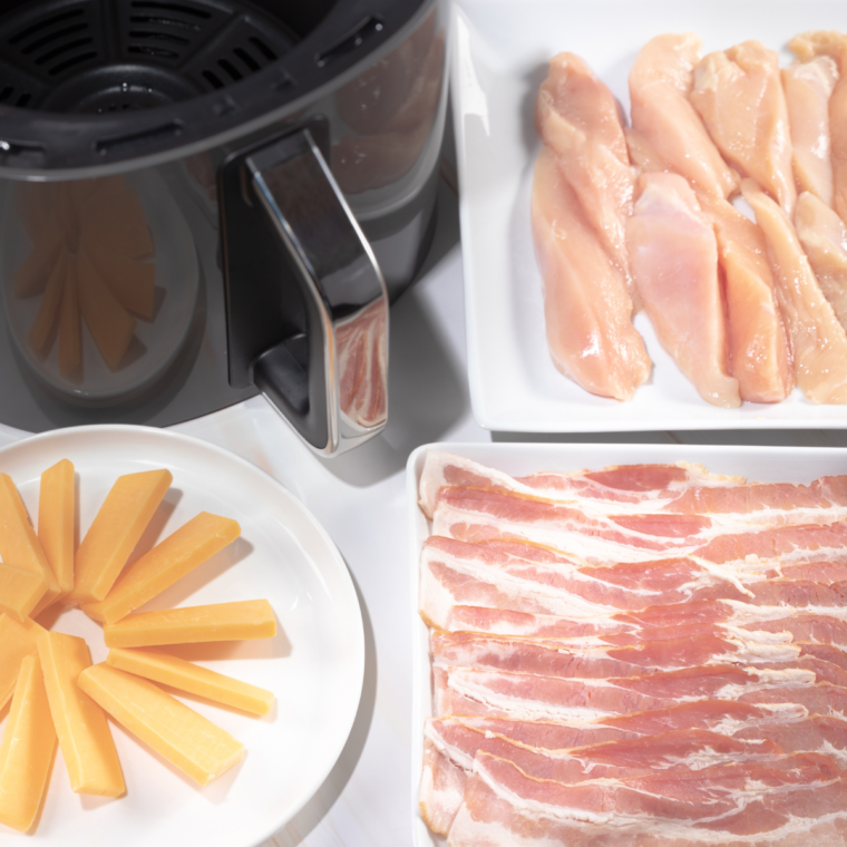 Ingredients Needed For Air Fryer Cheesy Bacon Wrapped Chicken on kitchen counter with air fryer basket.