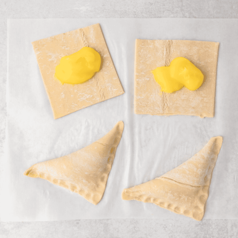 "Sealing edges of lemon turnovers with a fork."