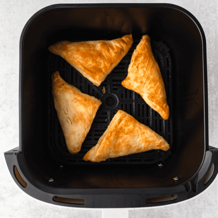 Golden-brown lemon turnovers fresh from the air fryer."