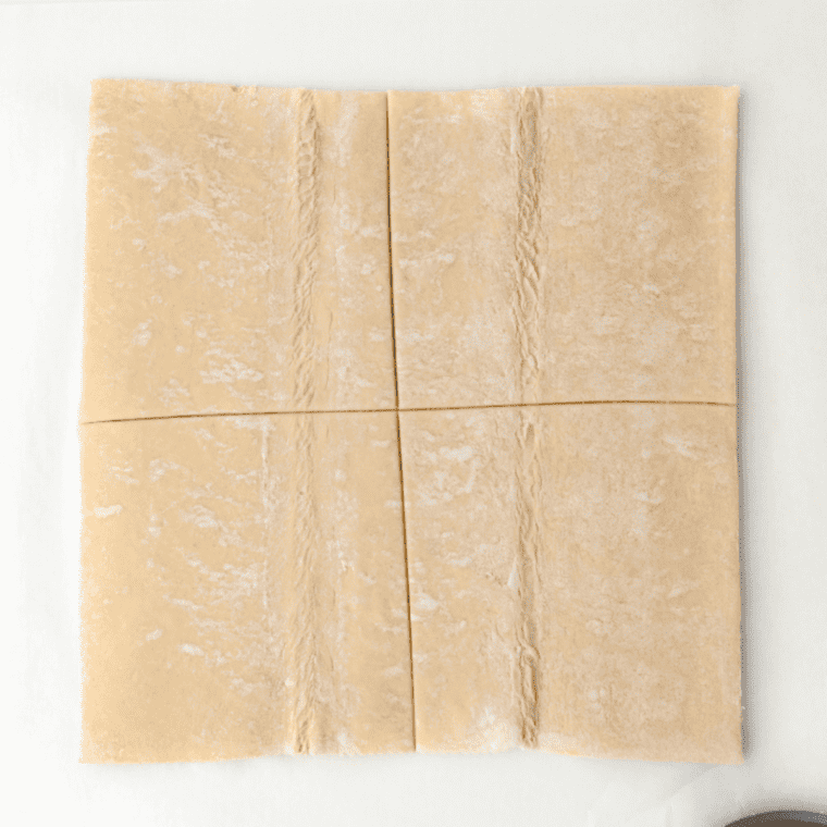 "Unfolding puff pastry sheets for Air Fryer Lemon Turnovers."