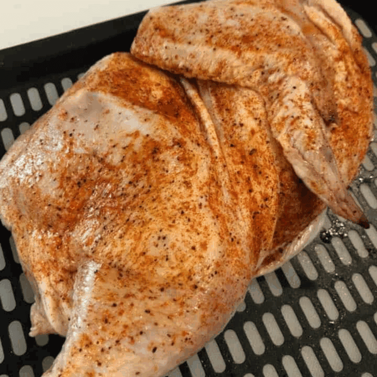 Roasting the herb-seasoned chicken to golden perfection.