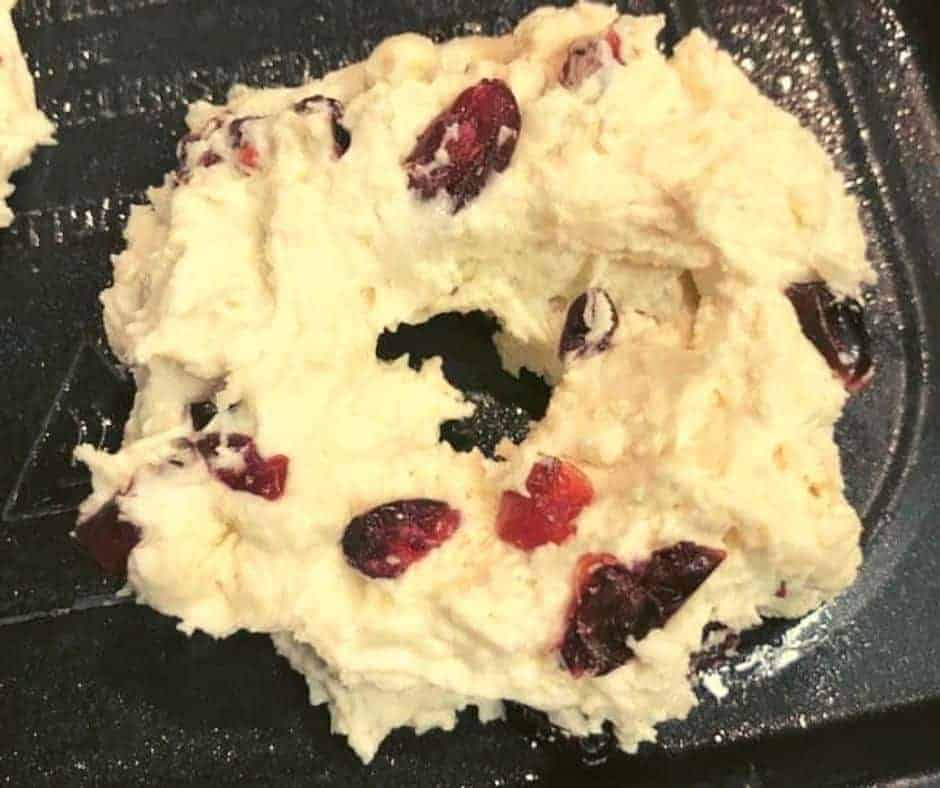 Shaping dough into bagels on a floured surface