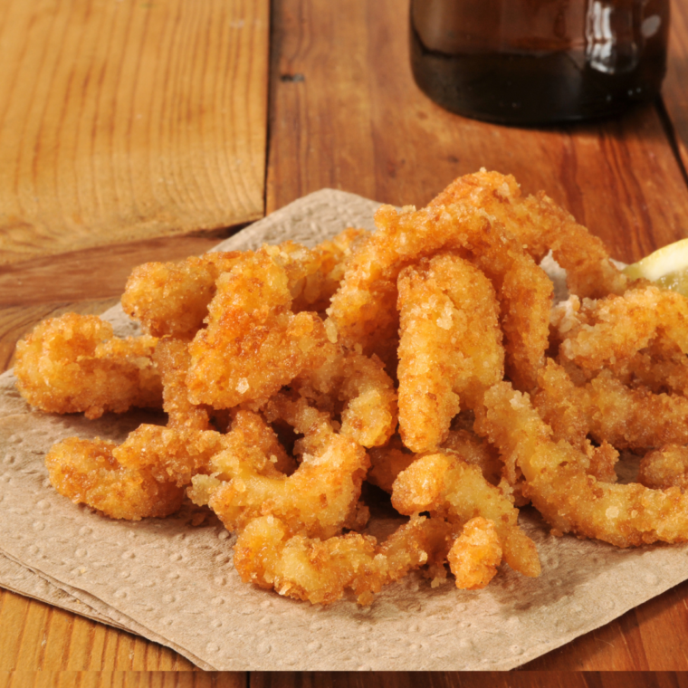 Close-up of crispy breaded air fried clams showing golden coating