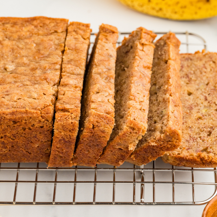 Cooling banana nut bread in pan before transferring to a wire rack to finish cooling.