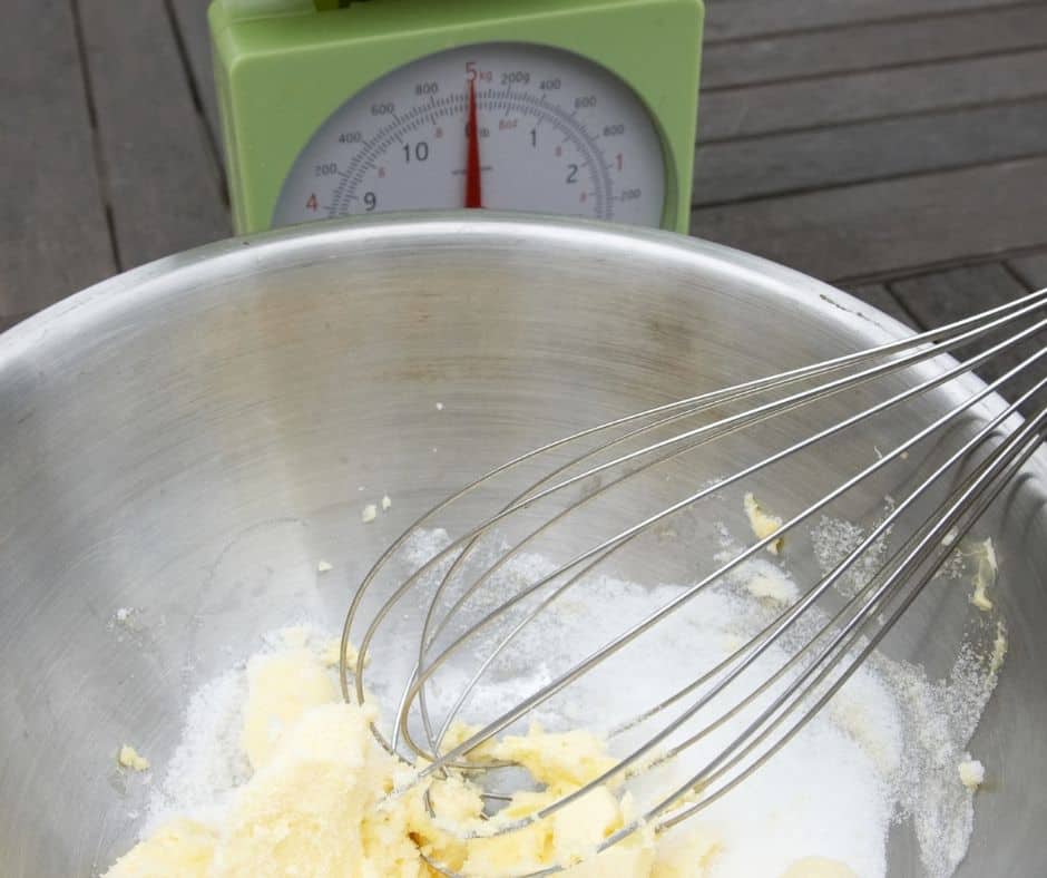 Start with making the cake, since it will be the bottom layer, In a large mixing bowl, cream the sugar and butter, then mix in the egg, sour cream, and vanilla extract. Then mix in the flour, baking powder, baking soda, salt and mix well.