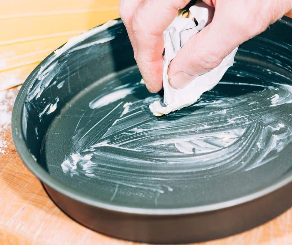 Pour the cake batter into a greased air fryer (anything that is oven safe is usually air fryer safe) pan,