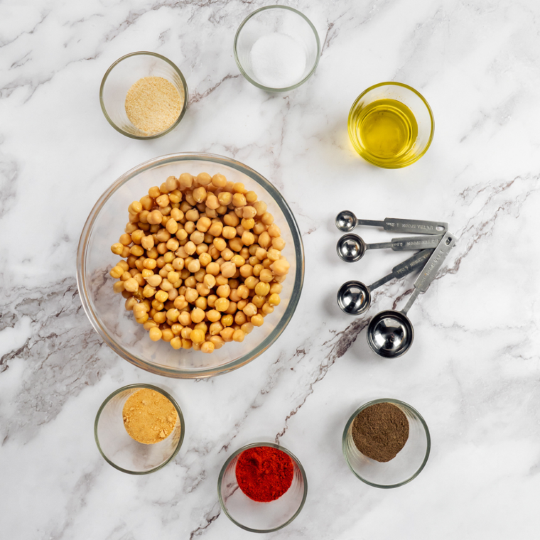 Ingredients for air fryer taco chickpeas: chickpeas, olive oil, chili powder, cumin, coriander, garlic powder, onion powder, and sea salt
