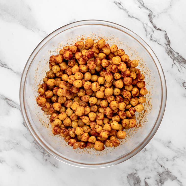 Chickpeas tossed with olive oil, chili powder, cumin, coriander, garlic, and onion powder for taco seasoning