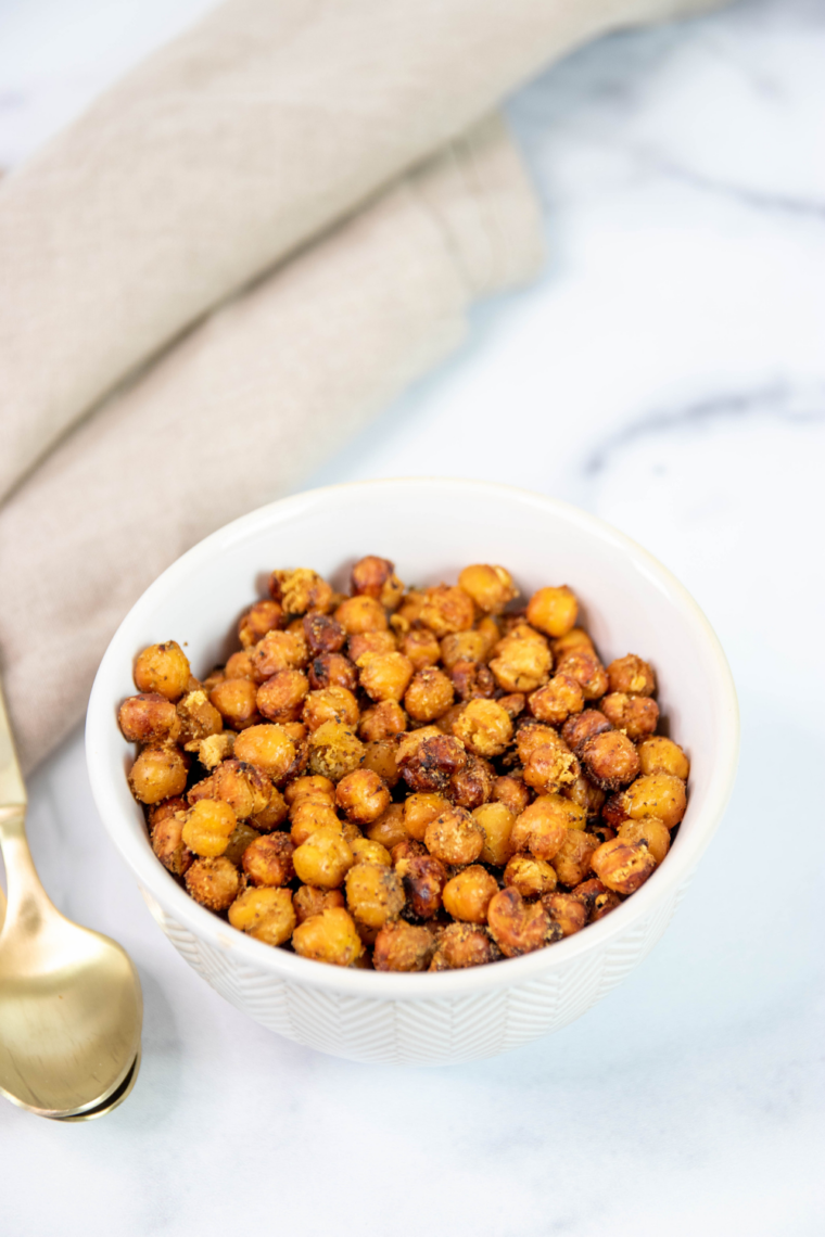 Bowl of crispy air fryer taco chickpeas dusted with chili powder and cumin, served as a healthy snack