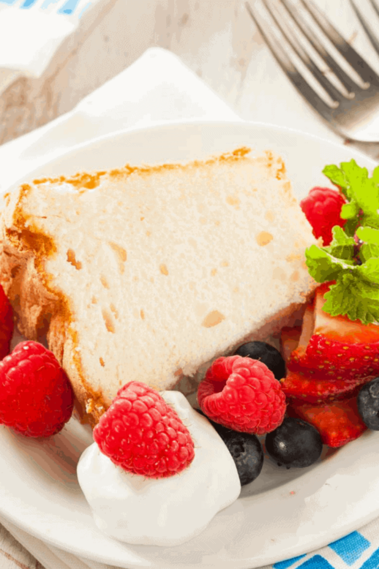 Golden, airy angel food cake fresh from the air fryer, sliced and ready to serve.